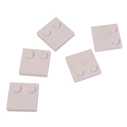 LEGO® Tile, Modified 2 x 2 with Studs on Edge (Part 33909) in white, used for SNOT techniques and detailed surface building
