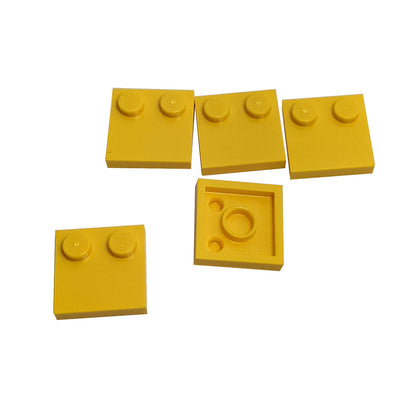 LEGO® Tile, Modified 2 x 2 with Studs on Edge (Part 33909) in yellow, used for SNOT techniques and detailed surface building
