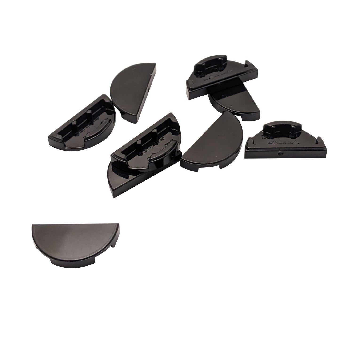 LEGO® Tile Round 1 x 2 Half piece shown in close-up, featuring its smooth curved top and half-moon shape in black.
