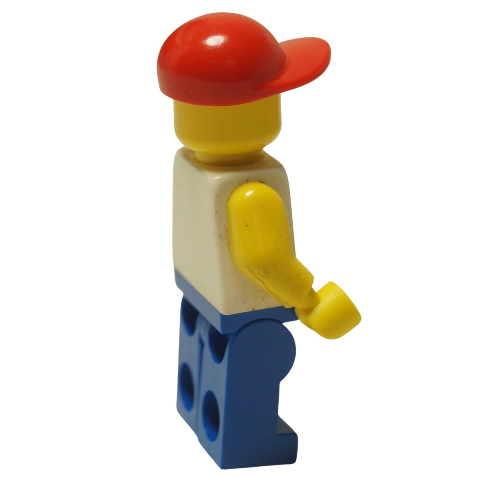LEGO Classic Town Trucker minifigure trc003 with blue legs and red cap. Side view.