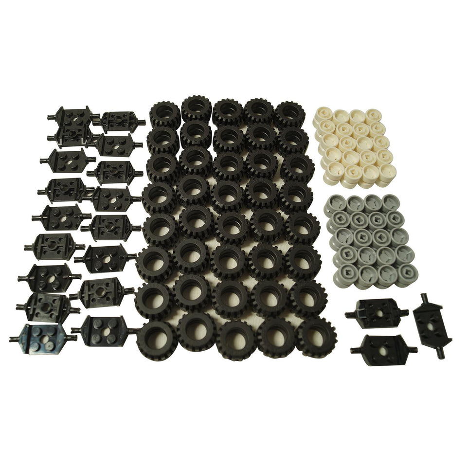 Assortment of LEGO Technic wheel parts: black studded tires, light tan and light bluish-gray rims, and black axle connector plates.