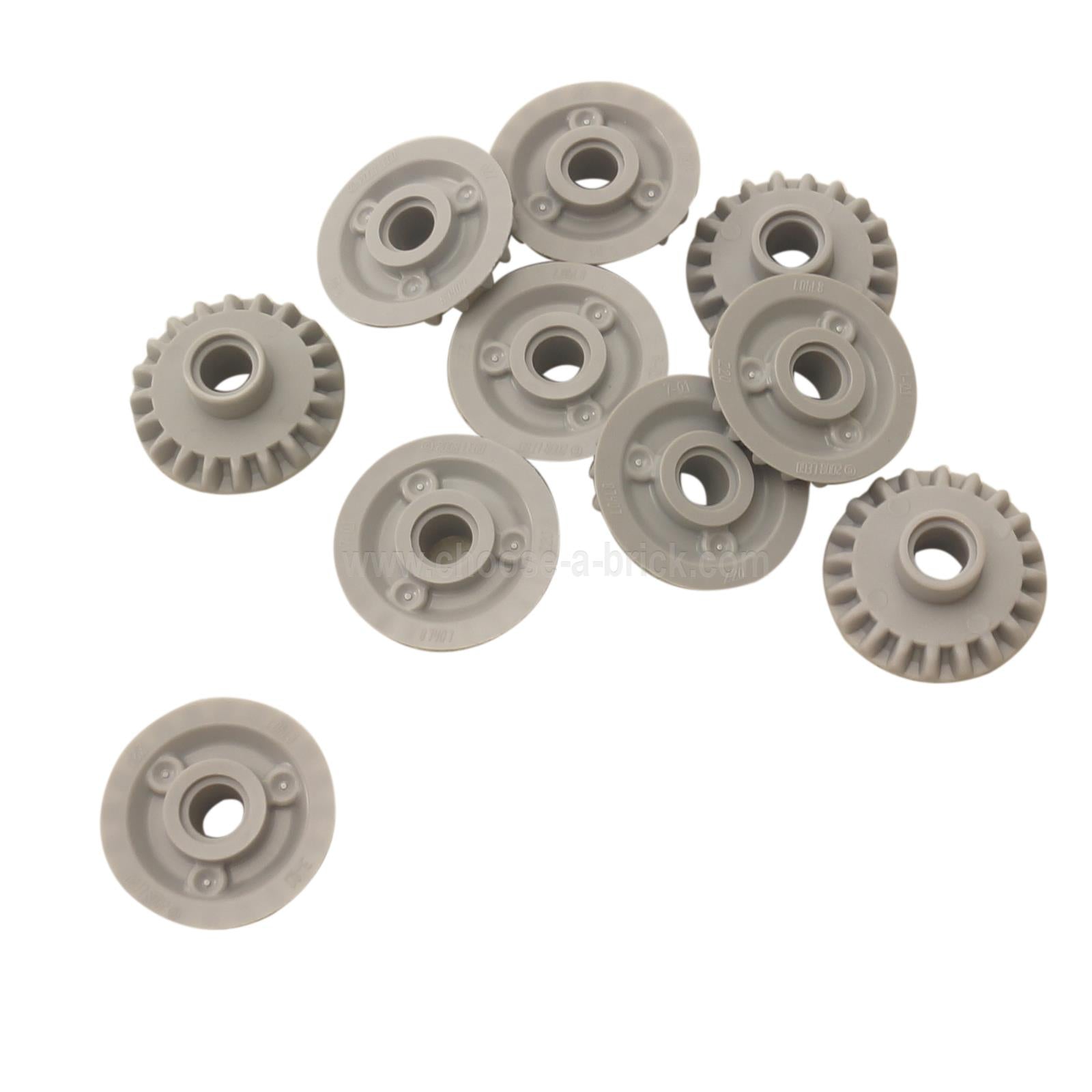 A group of ten light bluish-gray LEGO Technic 20T Bevel Gears (87407) scattered on a white background.