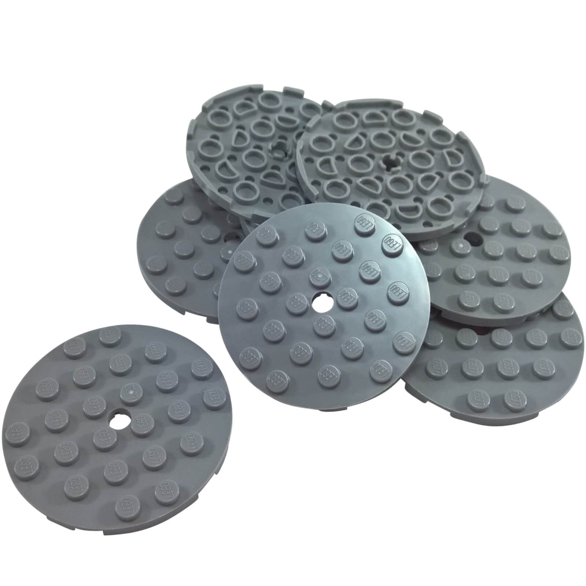 Light bluish gray LEGO® Round Plate 6 x 6 part 11213 shown from the top and underside with studs and a central hole