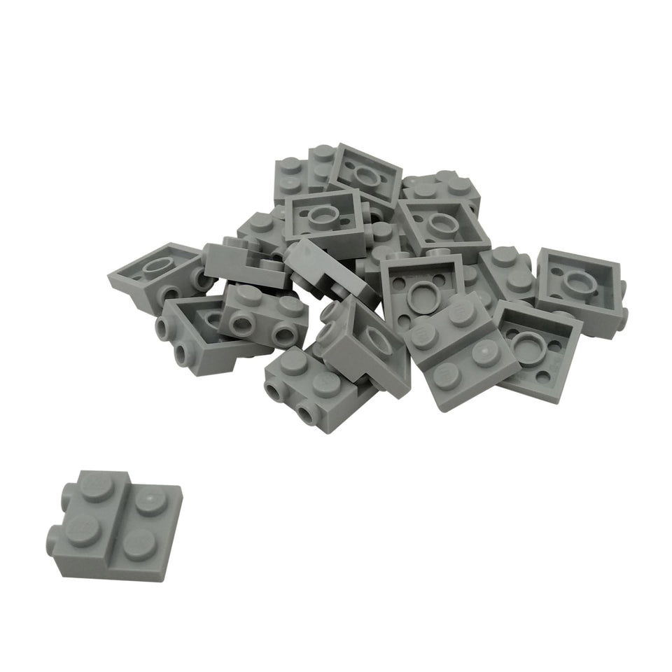 Lot of 20 light bluish gray LEGO® modified plate 2x2x2/3 with two side studs part 99206 SNOT building element close-up view