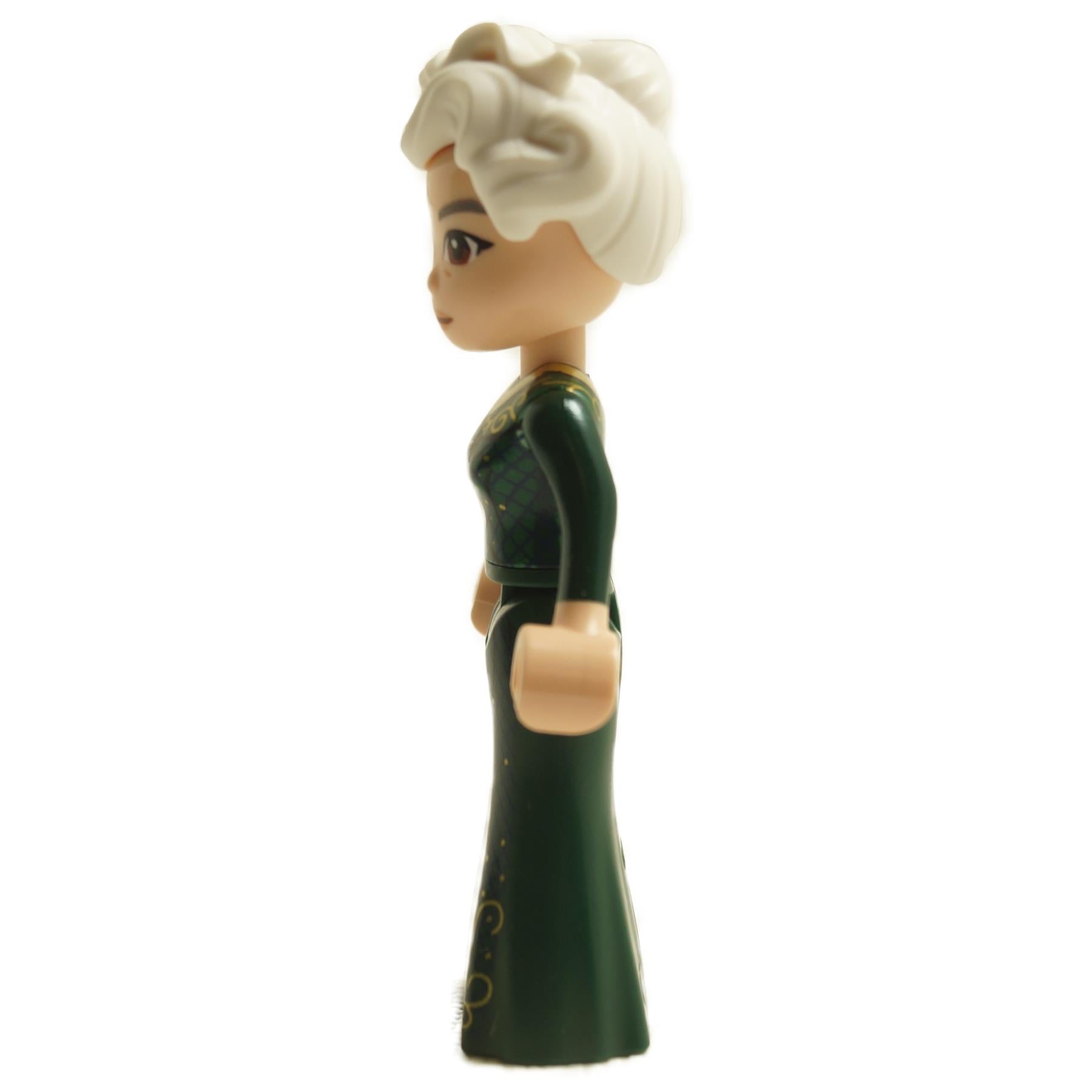 Side view of LEGO® Madame Morrible mini-doll wck006 with dark green dress and white hair styled in a bun
