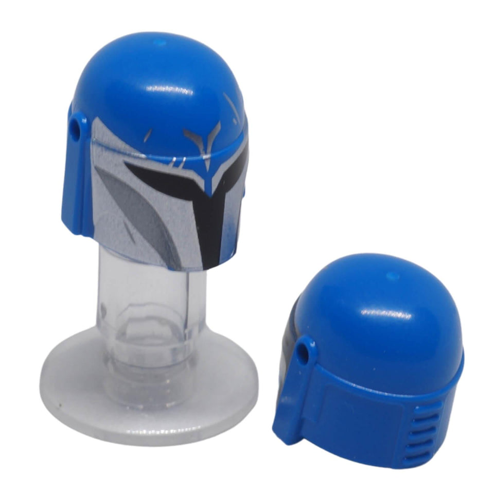 LEGO® Mandalorian helmet 87610pb25 in blue with a silver printed front, black visor and side accessory holes, shown from front and rear.