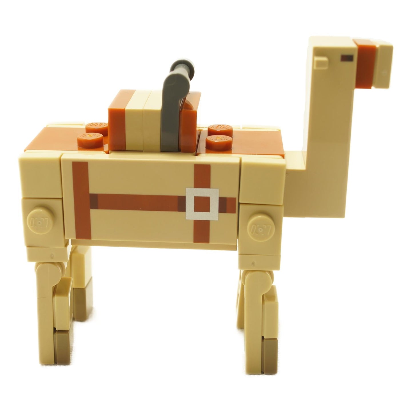 Profile view of LEGO Minecraft brick-built camel version 2 with tan body, printed strap detail, orange saddle block, and block-style articulated legs