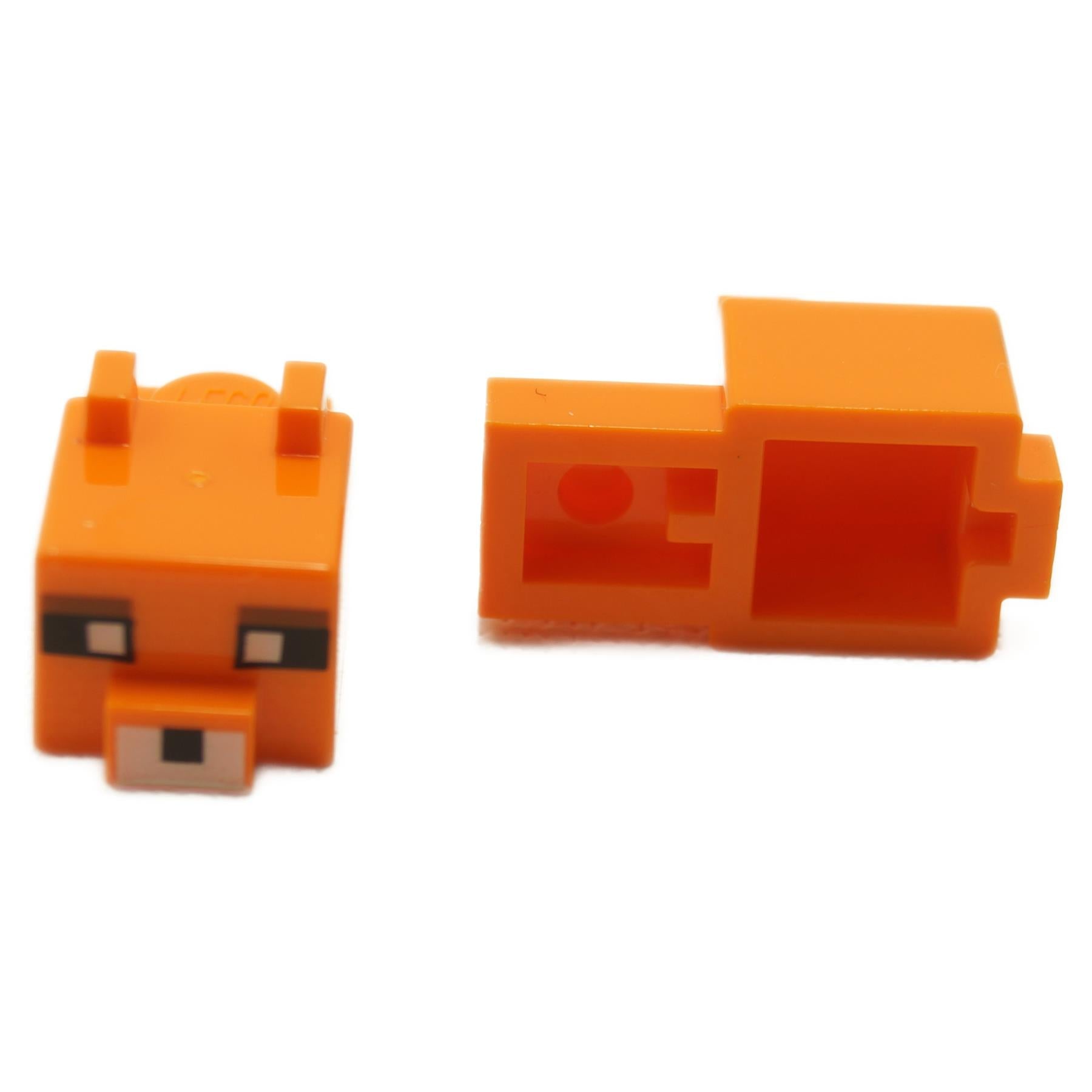 Minecraft Fox Head – Bright orange pixelated fox head with white square eyes, reddish brown eyebrow detail, and printed snout block design