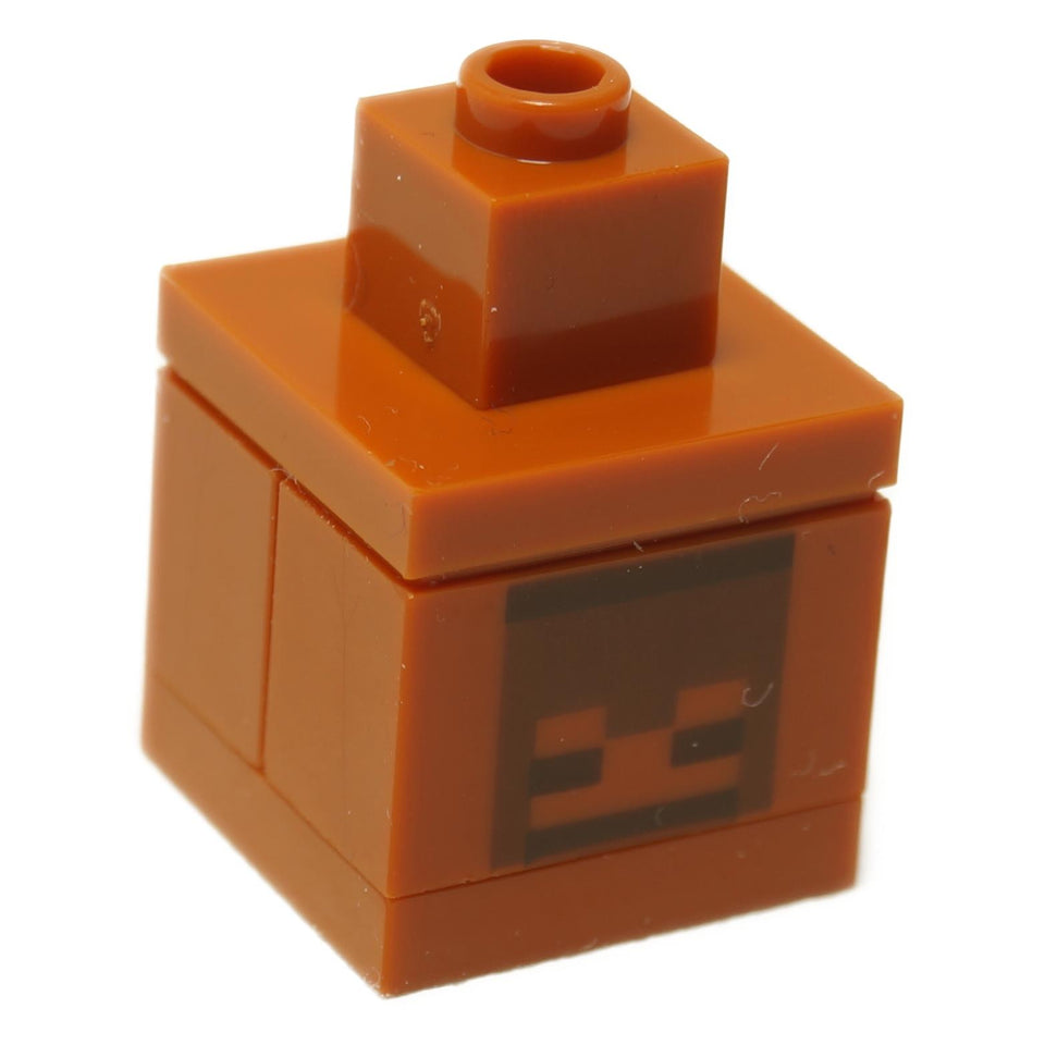 A LEGO Minecraft loot chest built from orange bricks with a creeper face design on the front.