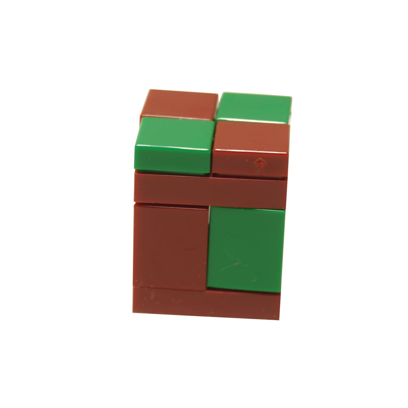 A LEGO Minecraft Sniffer Egg made of brown and green bricks, resembling the early stage of a Sniffer creature.