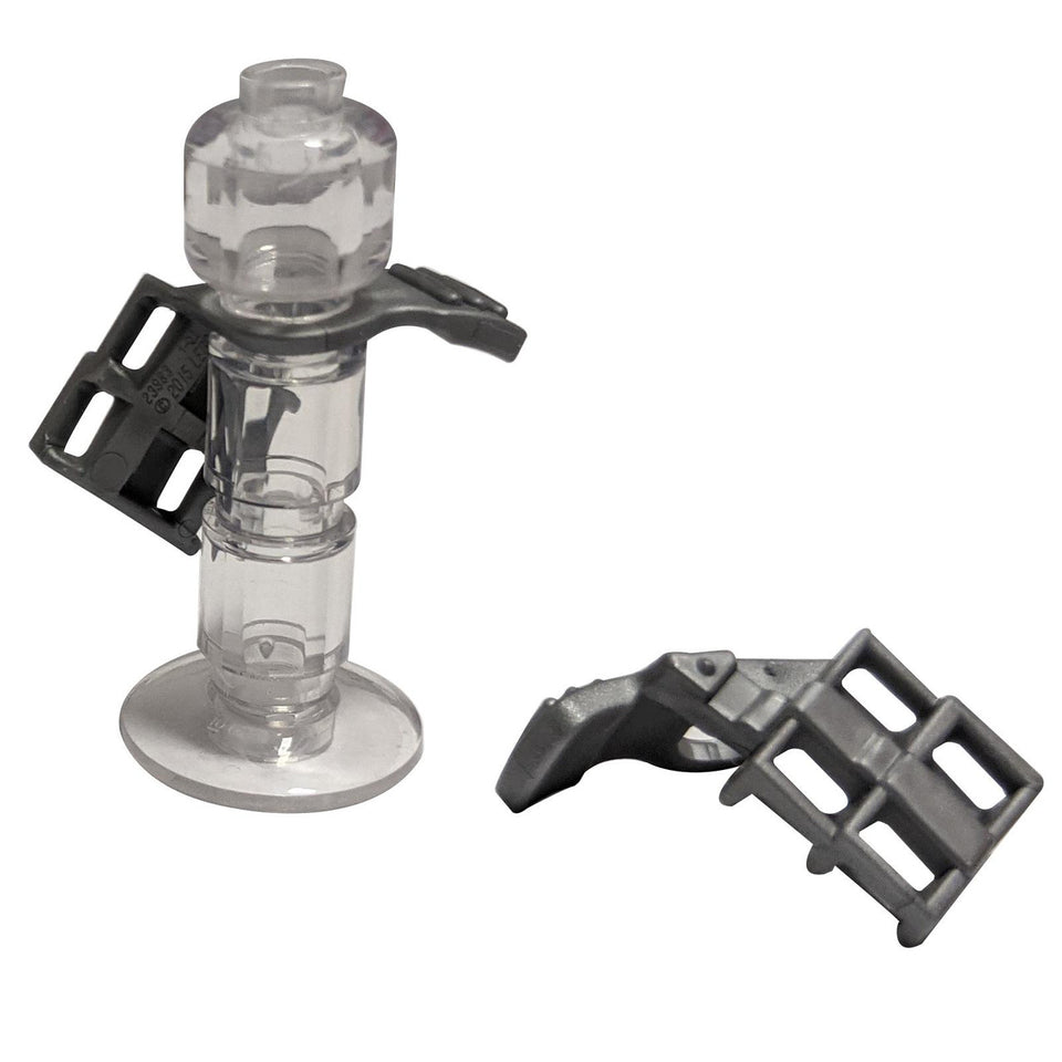 A LEGO minifigure armor shoulder pad with a scabbard for two katanas, made of clear plastic.