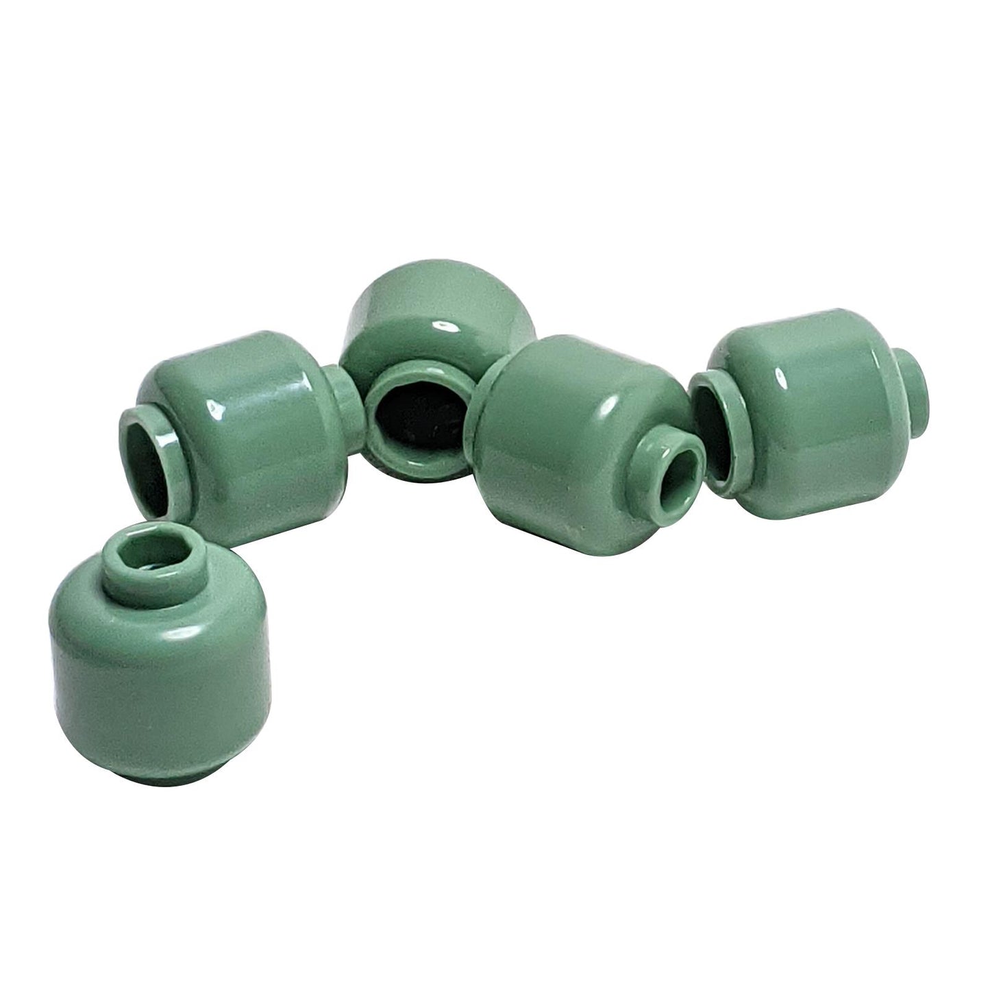 Plain sand green minifigure head with smooth cylindrical shape, stud on top and hollow underside