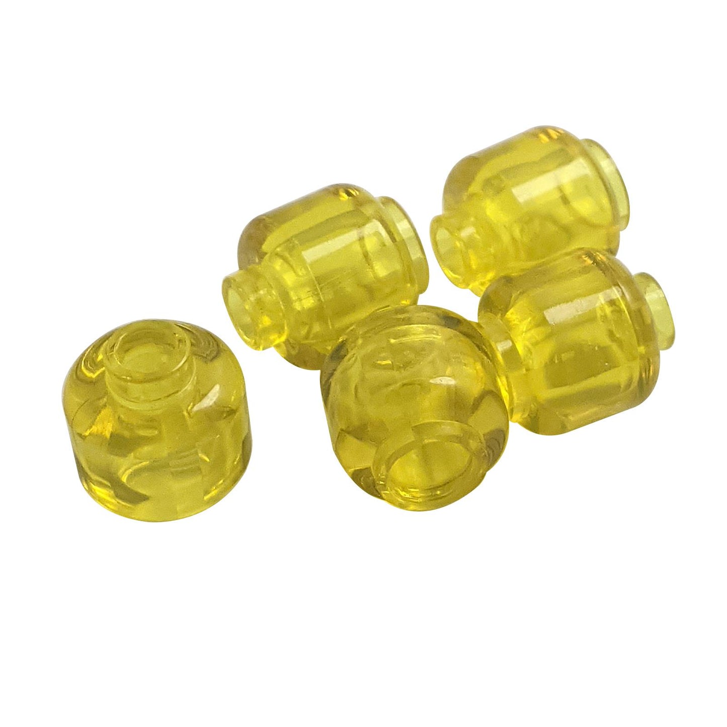 Transparent yellow plain minifigure head with smooth cylindrical shape, stud on top and hollow underside