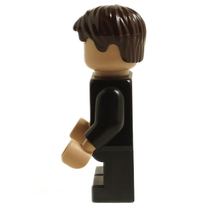 Side view of LEGO Neville Longbottom minifigure wearing Hogwarts robe with black tie