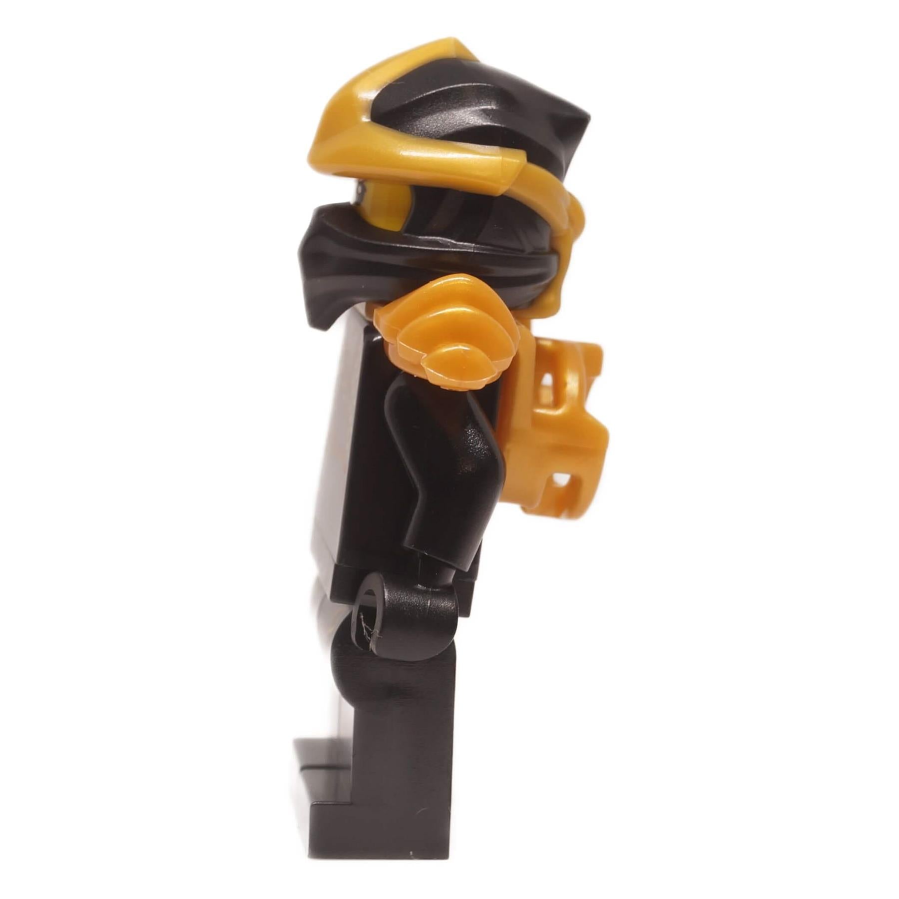 Cole ZX minifigure njo1004 left side view showing helmet profile, gold shoulder armor, and black arm
