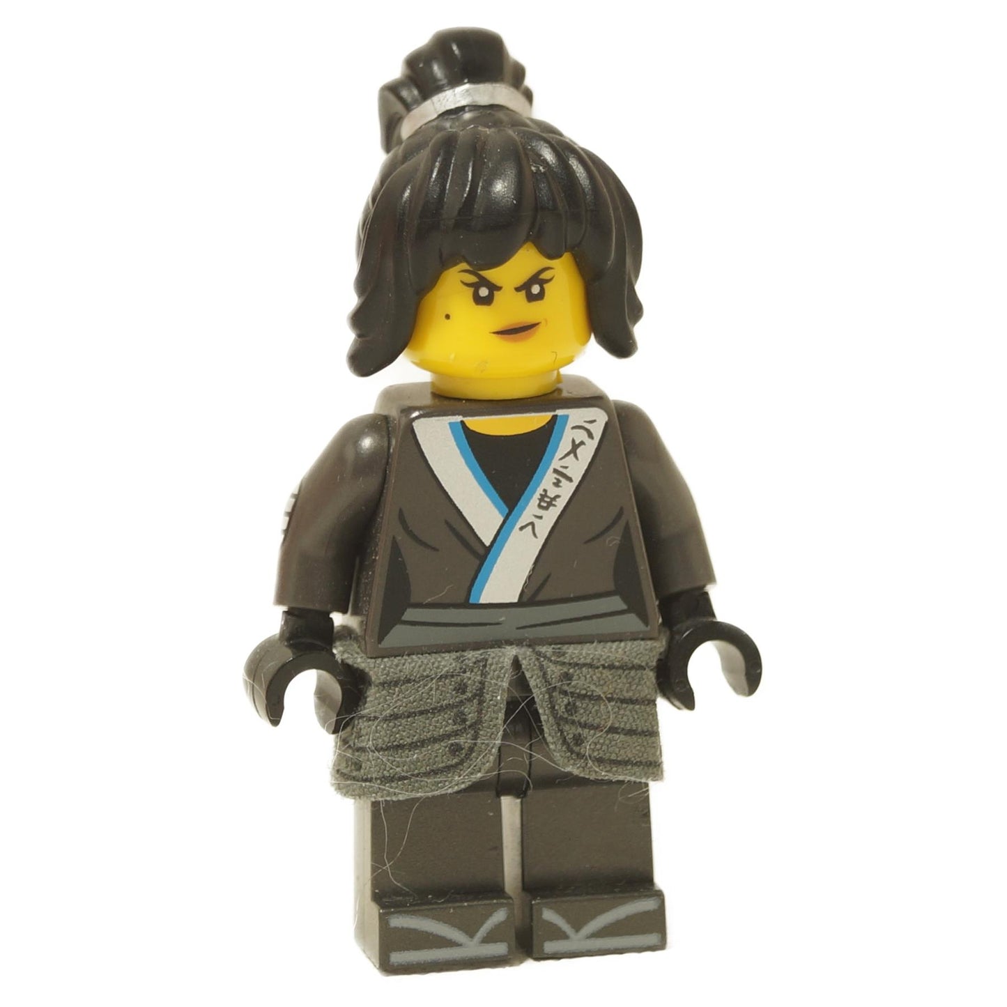 LEGO minifigure of Nya from The LEGO Ninjago Movie, wearing a gray and black outfit with a cloth armor skirt and black hairpiece.