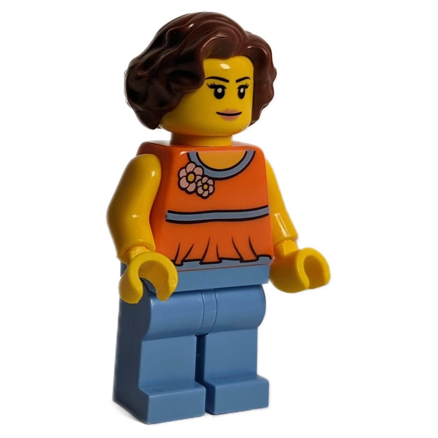 Minifigure with orange halter top, medium blue legs and reddish brown wavy hair
