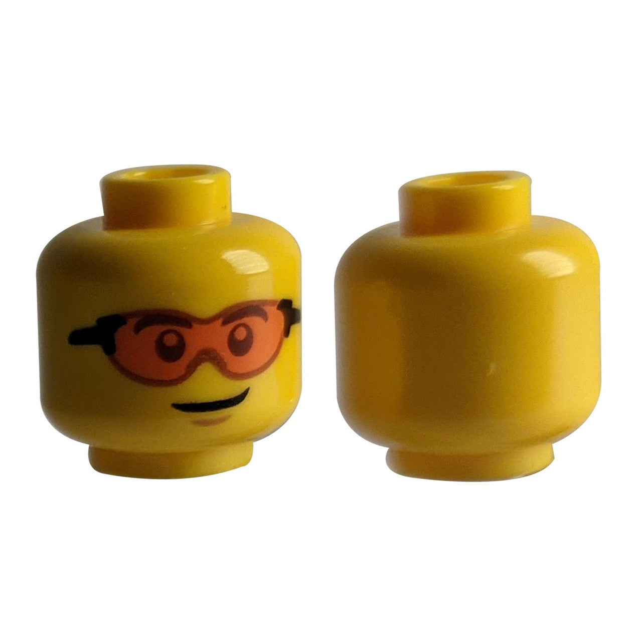 LEGO® Minifigure Head (3626pb2724) with a lopsided grin and printed orange safety glasses.