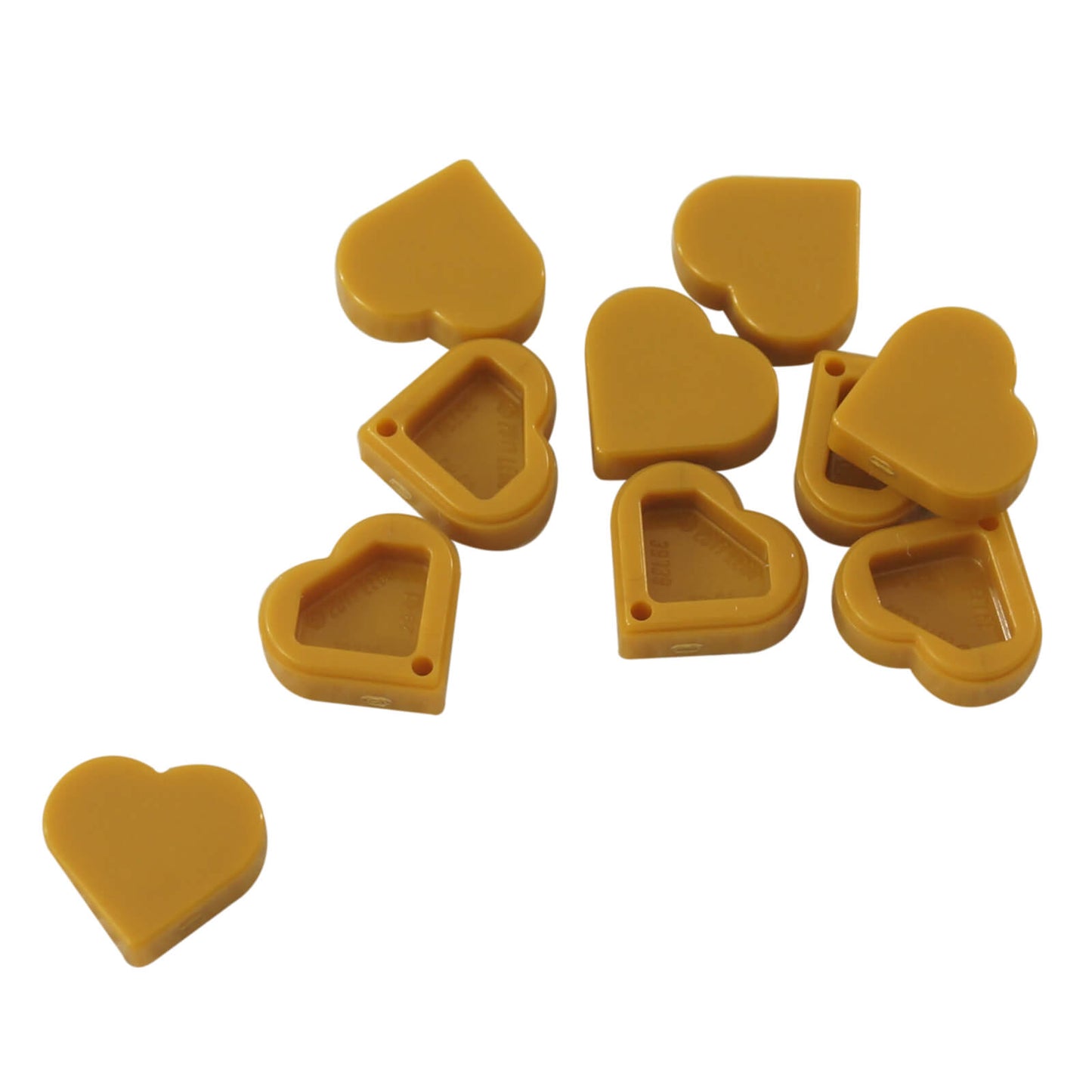Pearl Gold LEGO Tile, Round 1x1 Heart pieces (39739) shown: one smooth face up, one hollow side up.