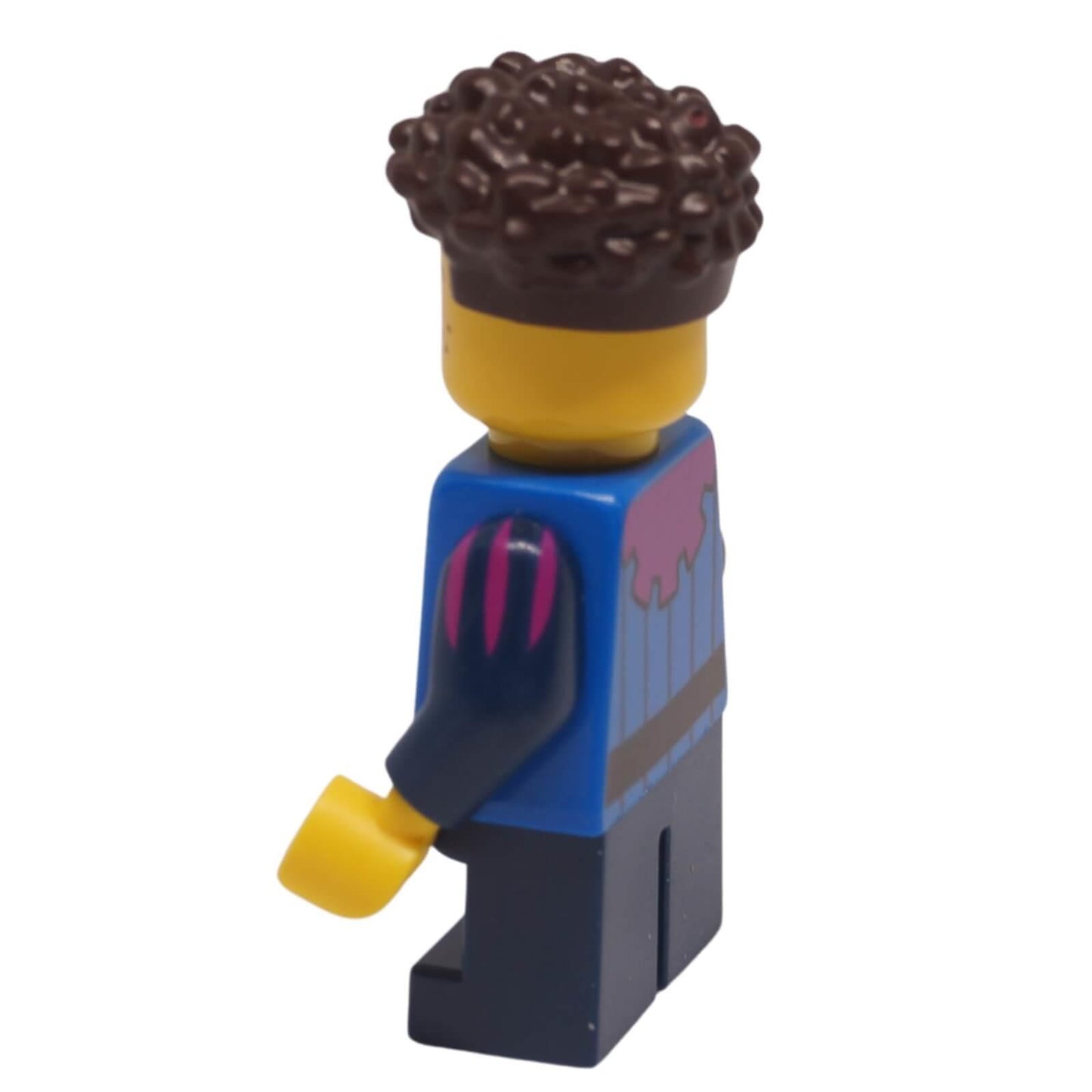 Side view of a peasant child minifigure with curly hair, wearing a blue tunic and dark legs.
