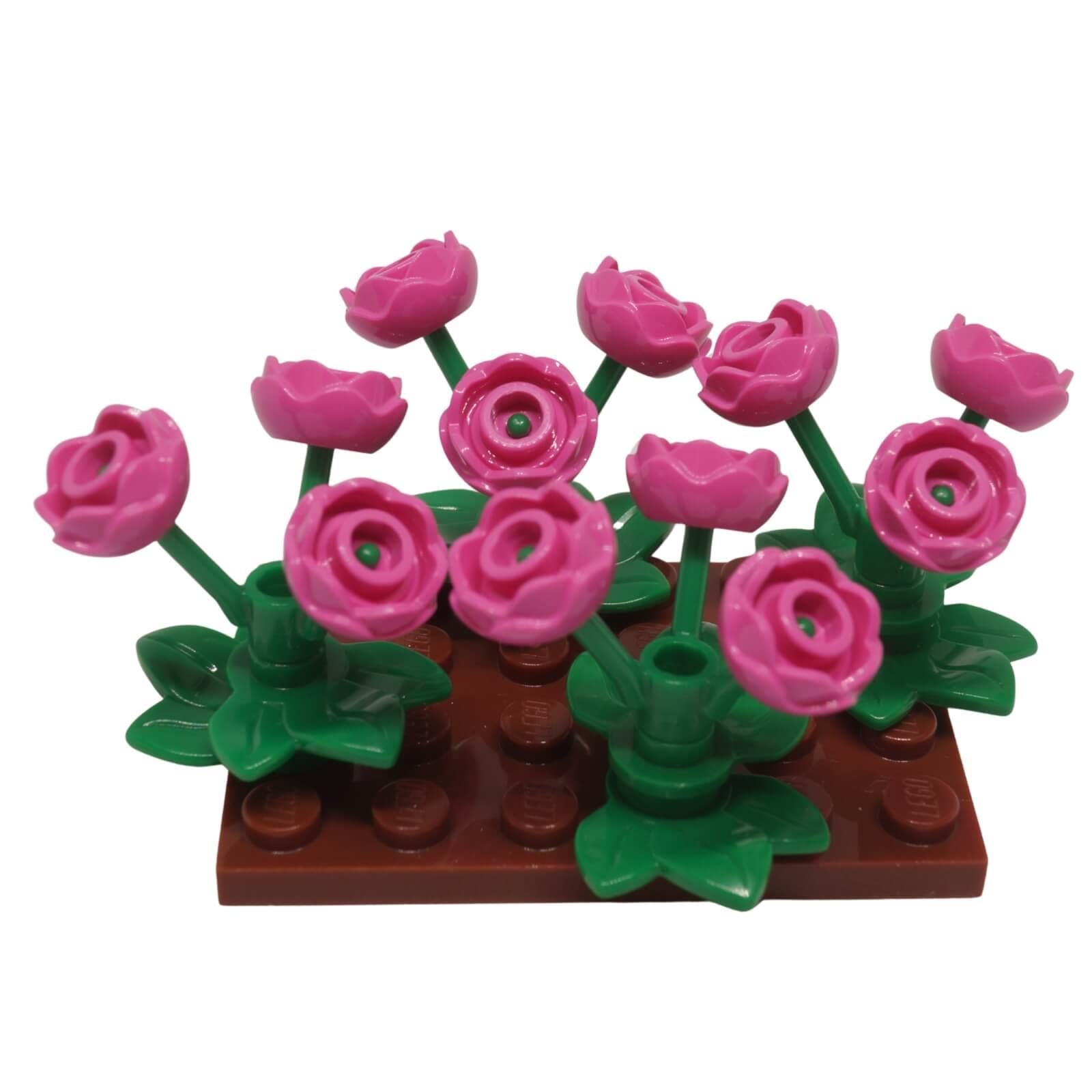LEGO pink rose flower garden display build with green plant stems and reddish brown base