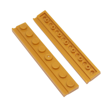 Pearl gold LEGO® modified plate 1x8 with door rail detail long narrow profile close-up view