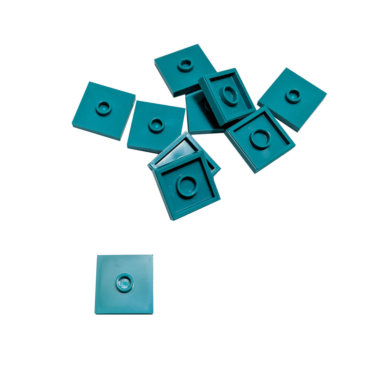 LEGO Plate Modified 2 x 2 with Groove and 1 Stud in Center part 87580 shown from top and underside dark turquoise
