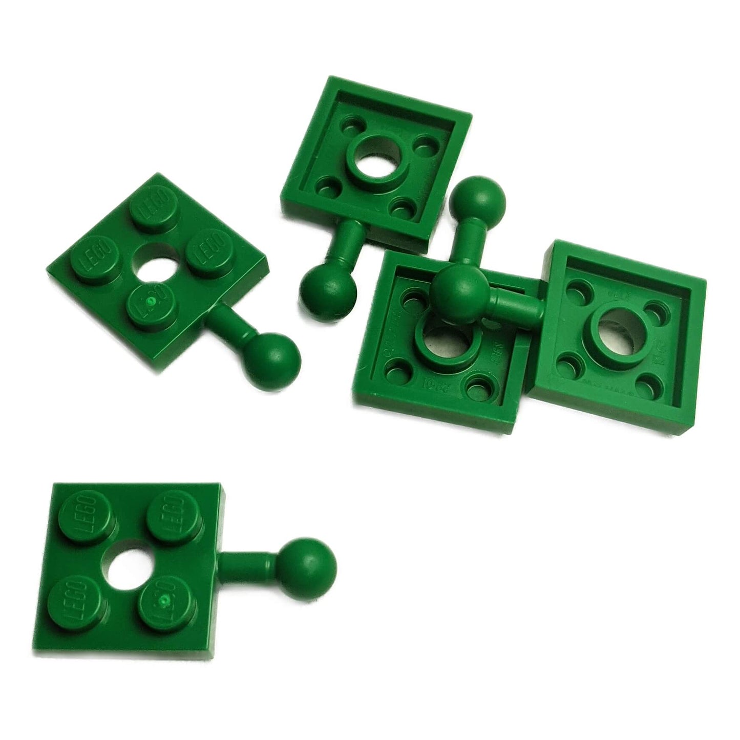 LEGO® piastretta modificata 2 x 2 con pallino e foro in verde, utilizzata per giunti e costruzioni articolate
