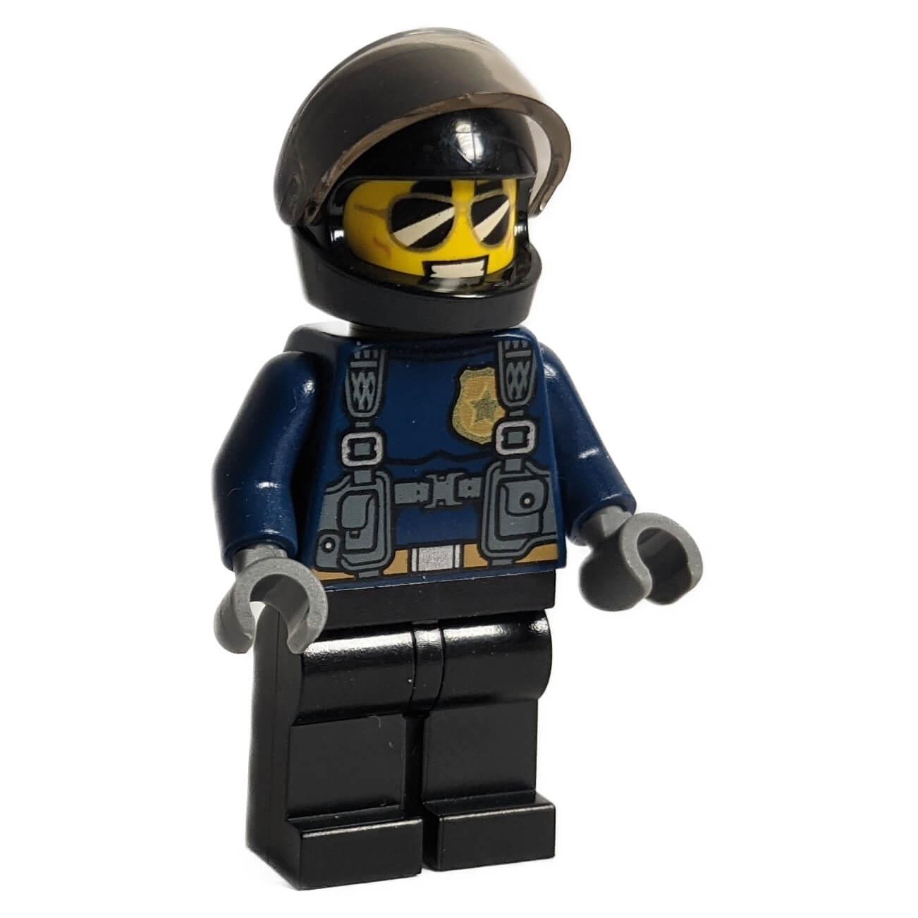 LEGO minifigure of a police officer named Duke DeTain, featuring a black helmet with a visor and a tactical police uniform.