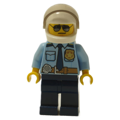 Front view of LEGO City Police Officer minifigure (cty1249) in light blue shirt, dark blue pants, and white helmet.