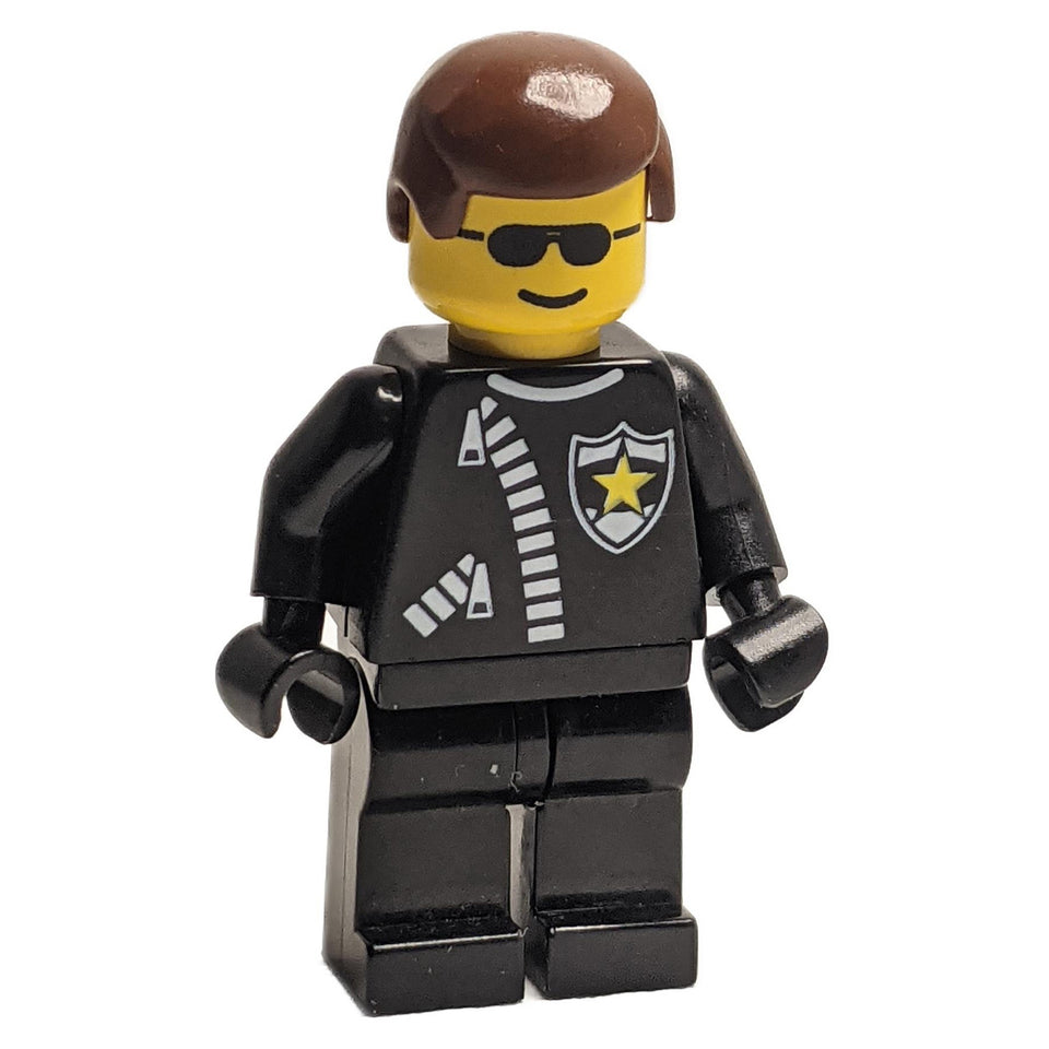 Police minifigure trn043 with zipper, sheriff star, and brown hair.