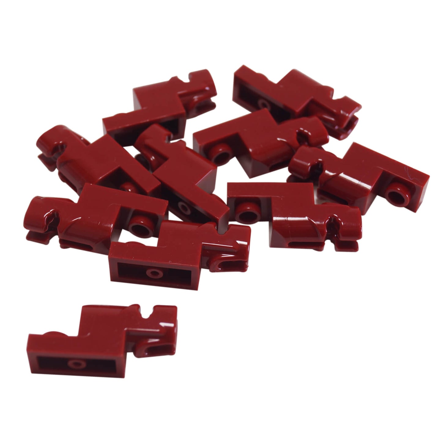 Scattered dark red LEGO Projectile Launcher 15403 pieces.