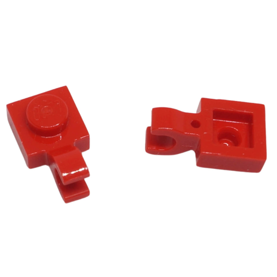 Red LEGO® modified plate 1 x 1 part 61252 shown from two angles with single stud and open horizontal O clip