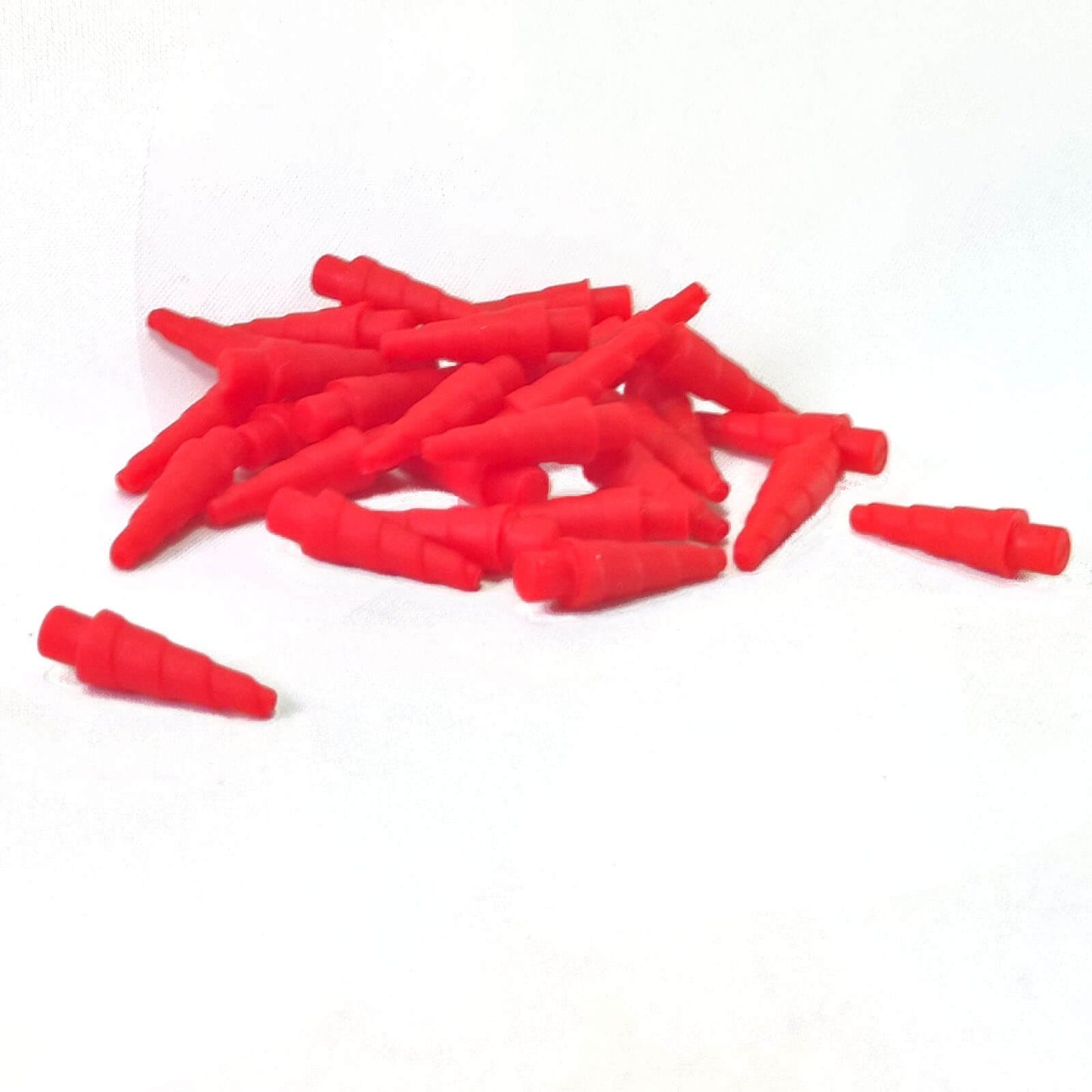Red unicorn horn accessory piece for minifigures, curved horn shape with pointed tip.
