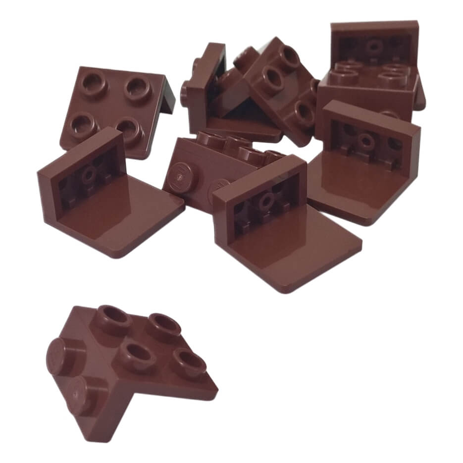 Pile of reddish brown LEGO Bracket 1x2 - 2x2 pieces (44728) with one piece separated at the bottom left.