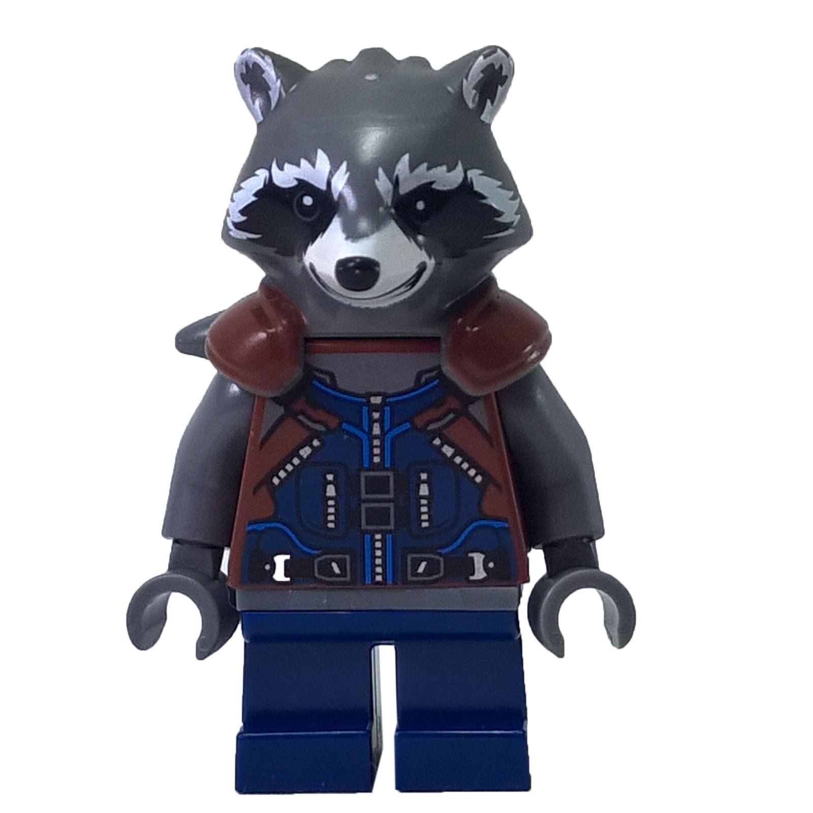  A LEGO® minifigure of Rocket Raccoon, featuring a dark bluish grey raccoon head with black eyes, white snout and cheek markings, a dark bluish grey torso with a printed dark blue and reddish-brown vest, dark bluish grey arms, grey hands, and dark blue legs, standing against a white background.