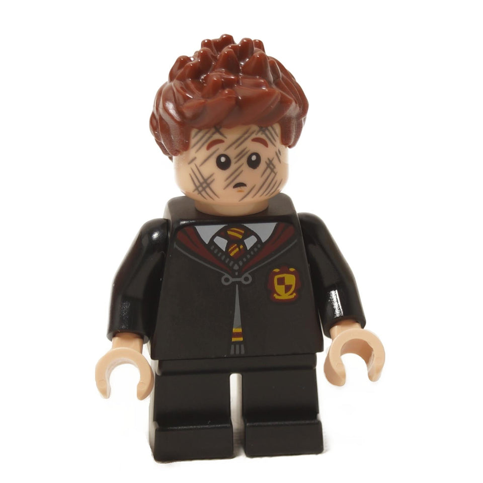 LEGO® Seamus Finnigan minifigure hp491 front view with worried expression and multiple scratch marks across face, clasped Gryffindor robe and black short legs close-up