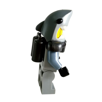 LEGO® Shark Army Great White minifigure wearing gray scuba suit with shark head helmet and air tank accessory side-view.