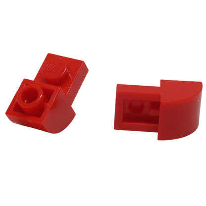 Red curved slope 2x1x1 1/3 with recessed stud, smooth angled element for detailed shaping and contours
