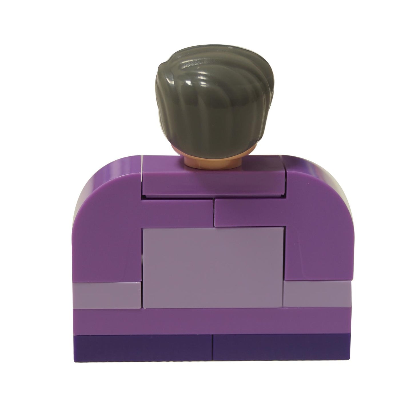 Vista trasera de la estructura de sillón de LEGO púrpura con la cabeza canosa visible por encima del respaldo.