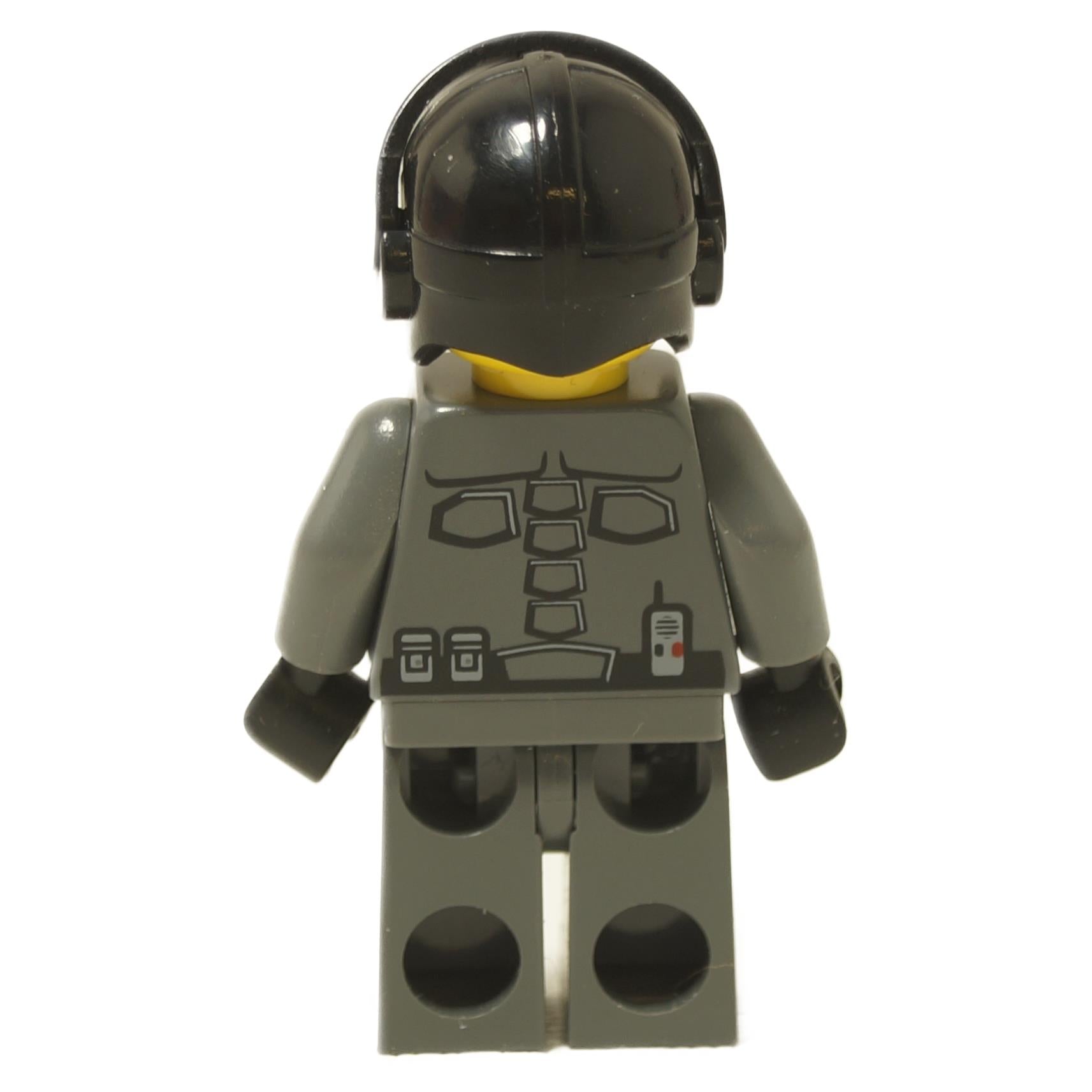 Back view of Space Police 3 Officer 1 minifigure 5969 with dark gray uniform print, utility details, and black helmet