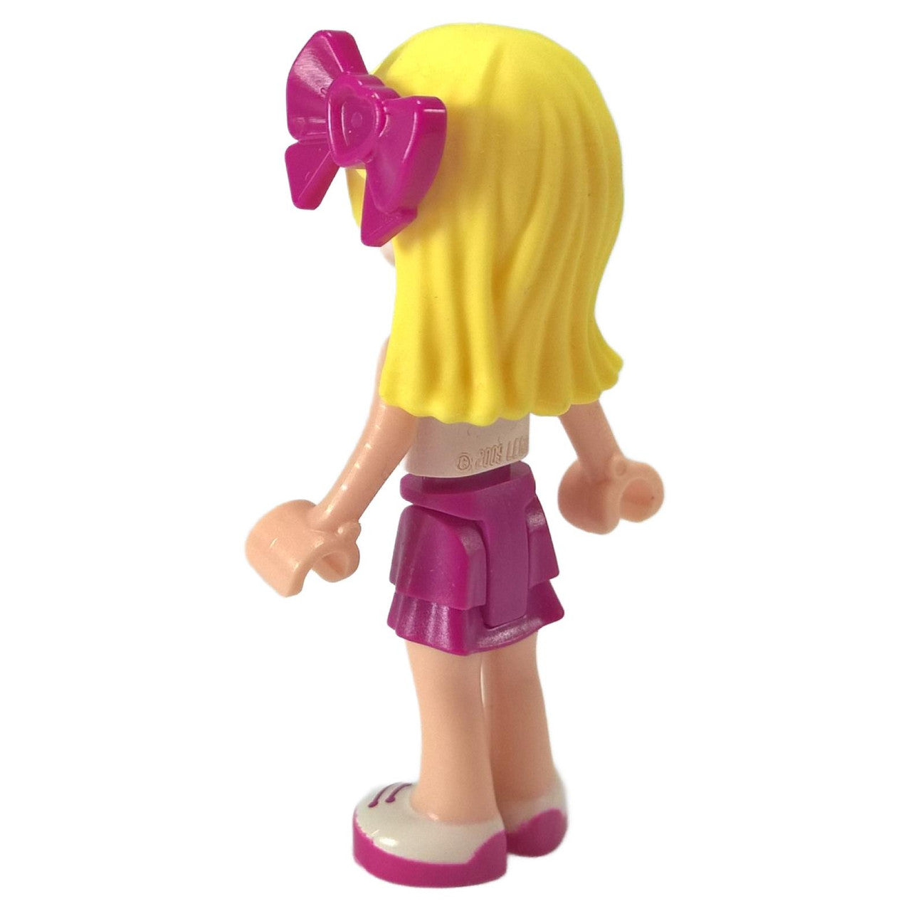 LEGO Stephanie minifigure frnd0125 with one shoulder star top and bow hair accessory, side view