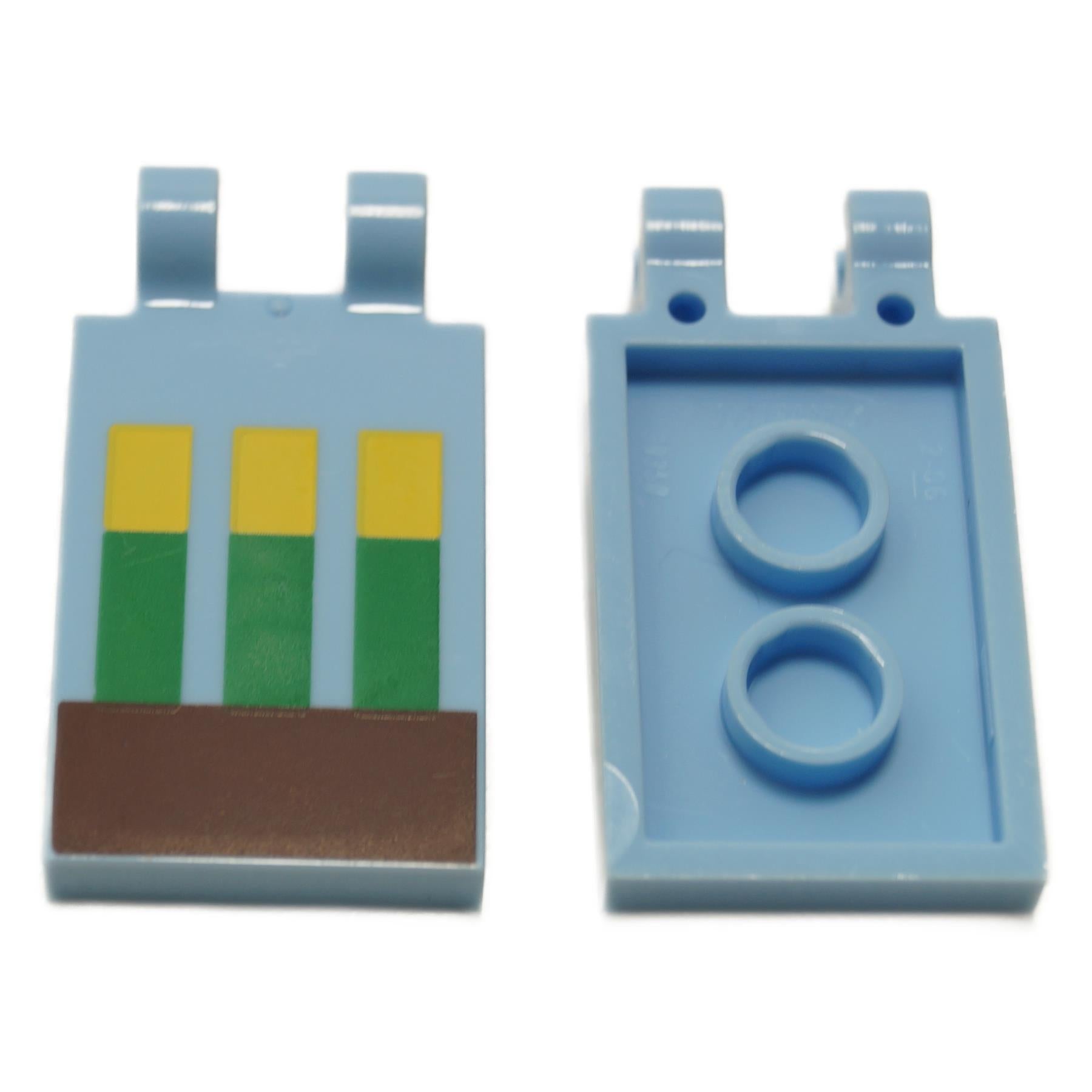 A LEGO Minecraft bright light blue tile with a pixelated wheat in ground pattern and two clips.
