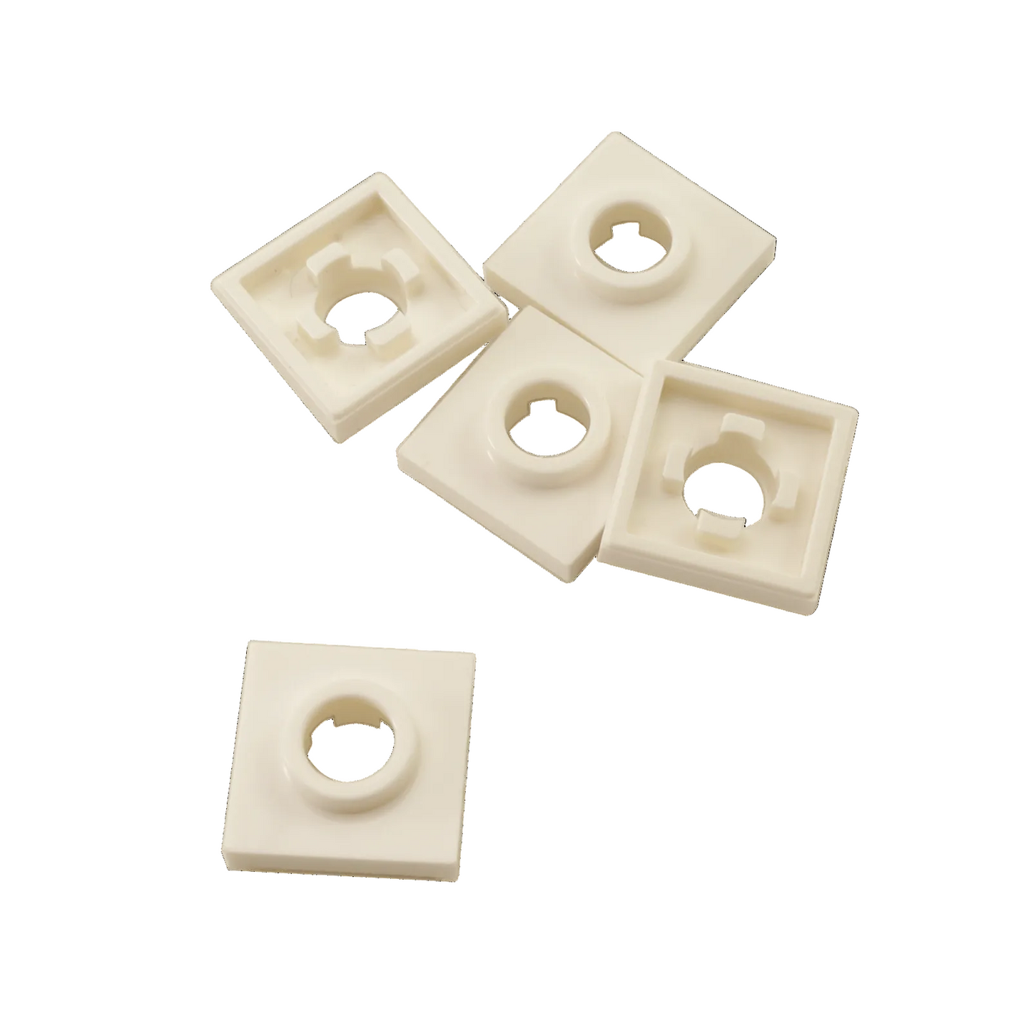 White modified 2x2 tile with large center hole, flat element used for detailing, vents, or axle pass-throughs
