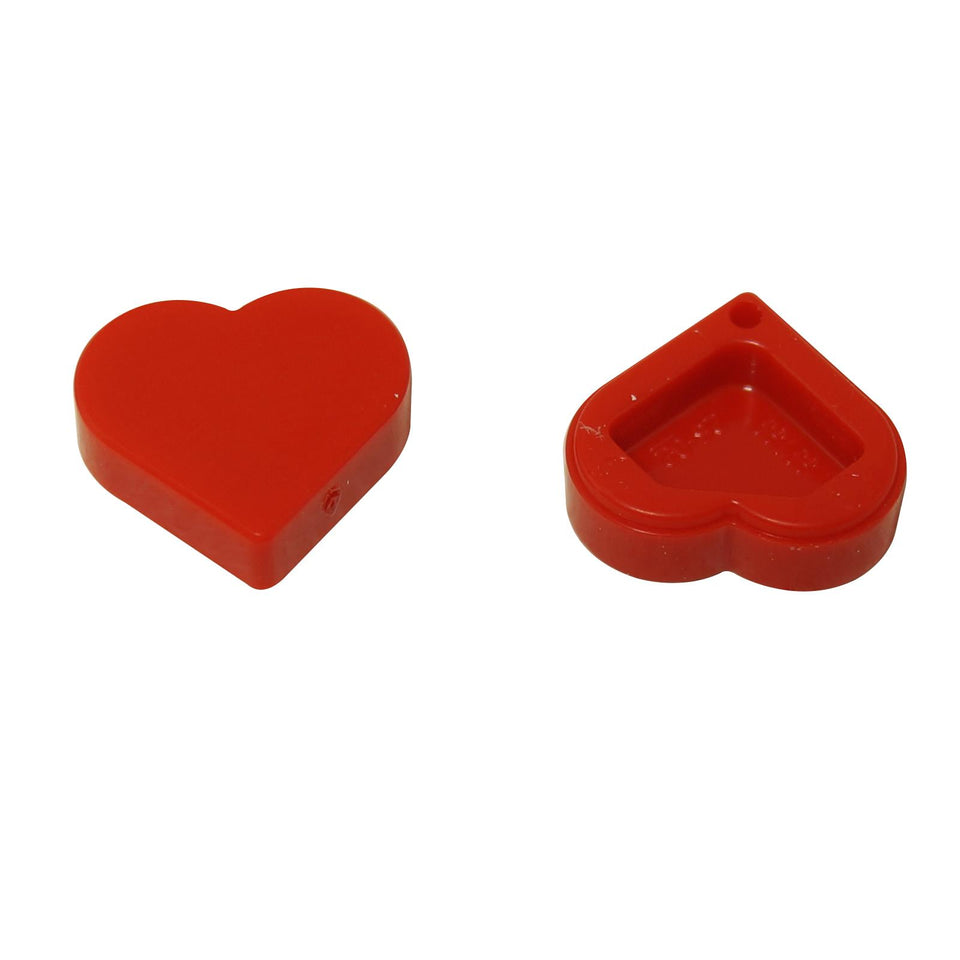 The LEGO® Tile, Round 1 x 1 Heart (Part 39739). A small, smooth, heart-shaped tile used for decoration and detail on LEGO models.