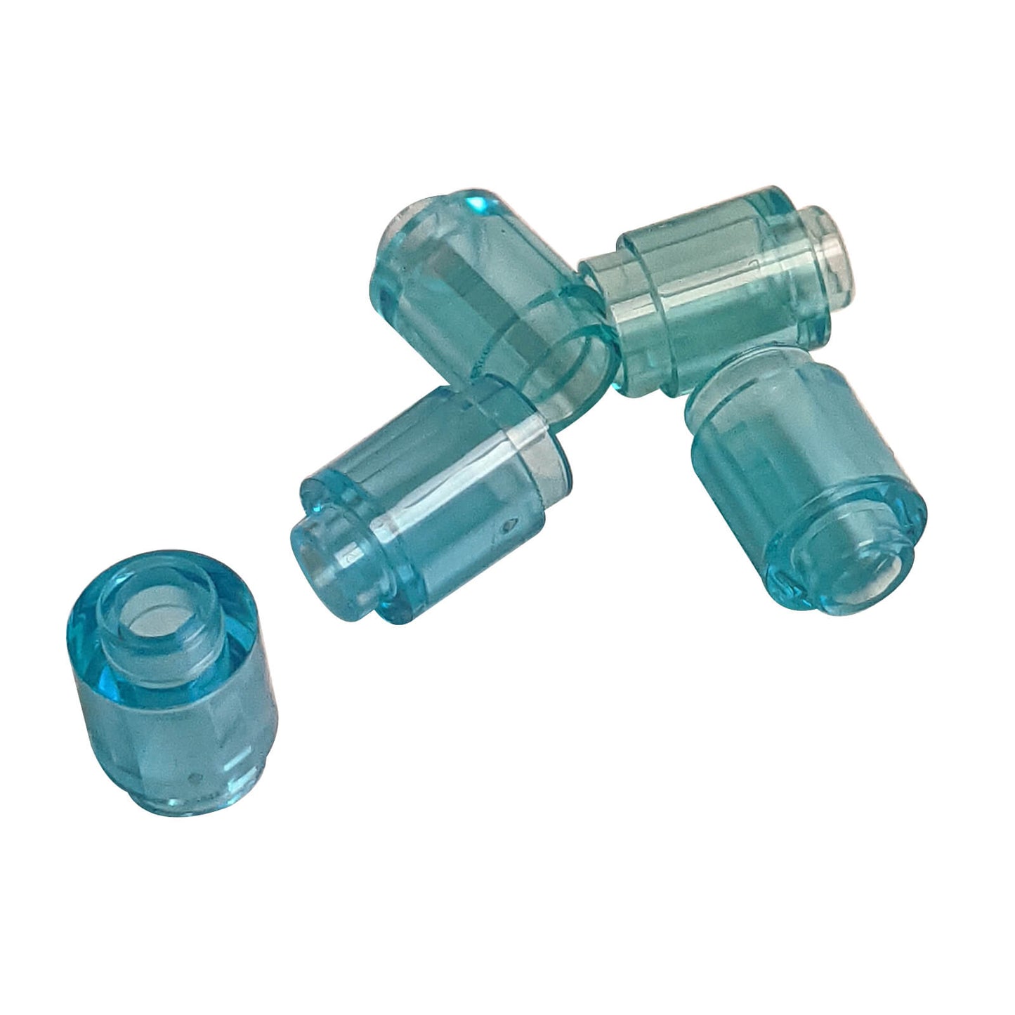 Trans bright light blue round 1 x 1 brick part 3062 with cylindrical shape for LEGO® transparent builds
