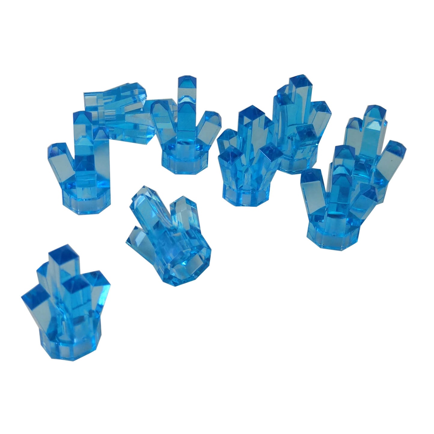 Multiple LEGO® trans-medium blue Rock 1 × 1 Crystal 5 Point elements shown from various angles