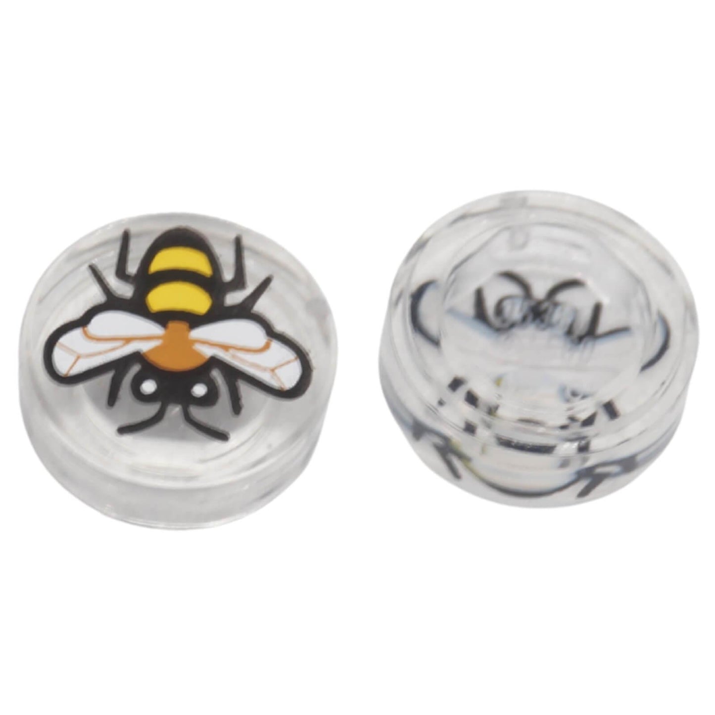 Top and underside view of LEGO® transparent round 1 × 1 tile 98138pb448 with a printed bee design