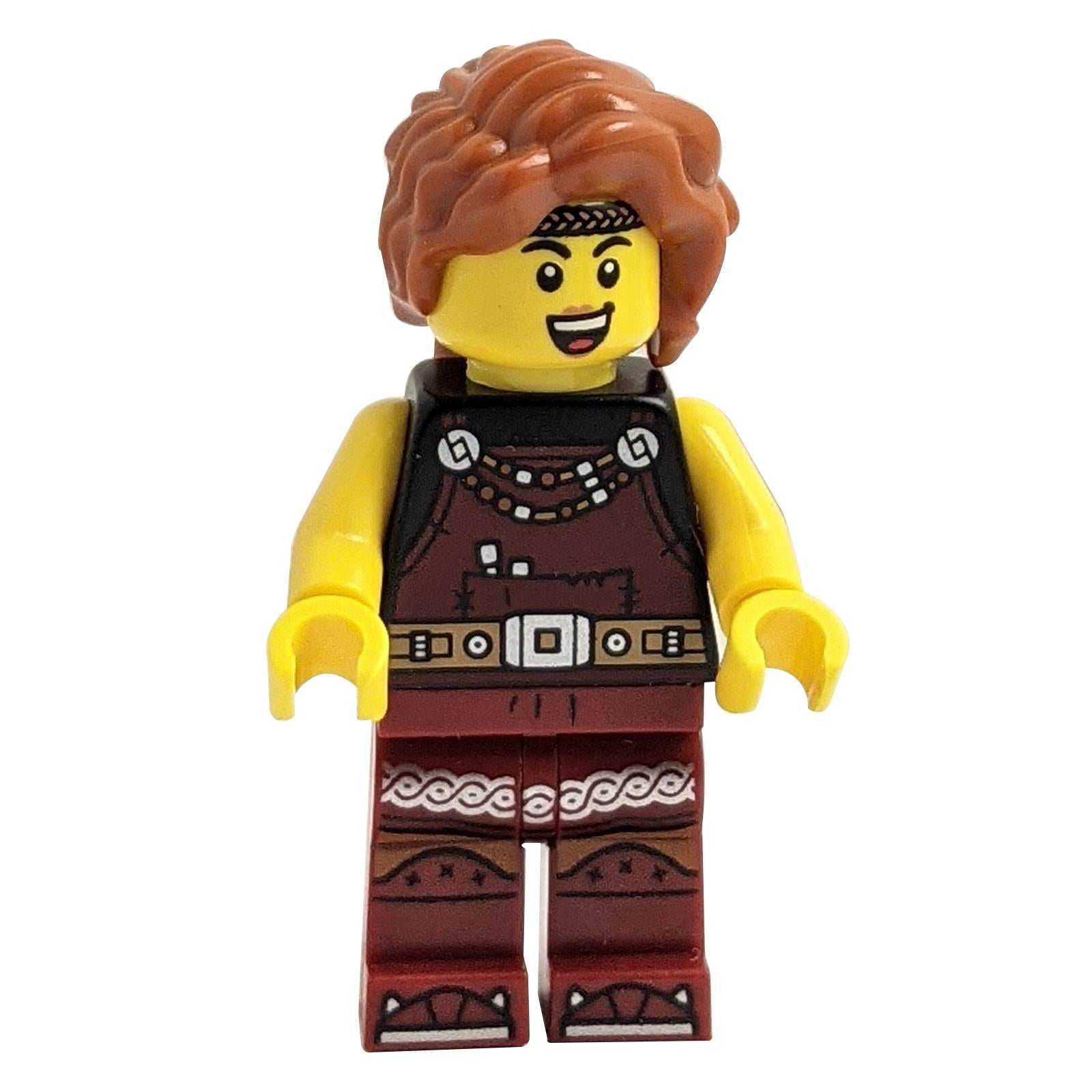 LEGO minifigure of a Viking Blacksmith female character with dark red overalls and dark red legs with trim, and dark orange hair.