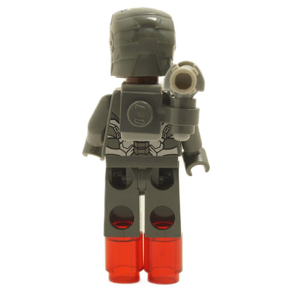 Back view of LEGO® War Machine minifigure sh0066 showing dark gray armor back printing, shoulder cannon, helmet, and trans-red jet boots
